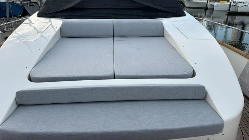  Yacht Photos Pics 1998 Azimut 85 Ultimate yacht with cushioned sunbathing area, docked at marina.