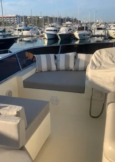  Yacht Photos Pics 1998 Azimut 85 Ultimate yacht interior with cushioned seating, docked at a marina.