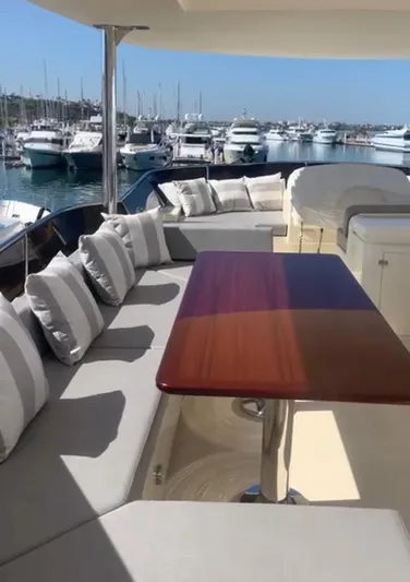  Yacht Photos Pics Luxurious 1998 Azimut 85 Ultimate yacht with elegant outdoor seating and marina view.