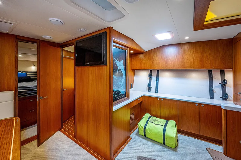 Wanted Yacht Photos Pics Interior of 2012 Cabo 44 HTX yacht with wood paneling and modern amenities.