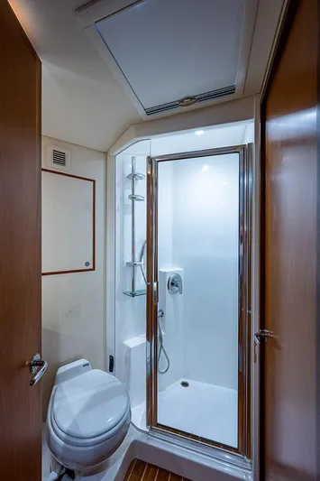 Wanted Yacht Photos Pics Luxurious bathroom in 2012 Cabo 44 HTX yacht with shower and toilet.