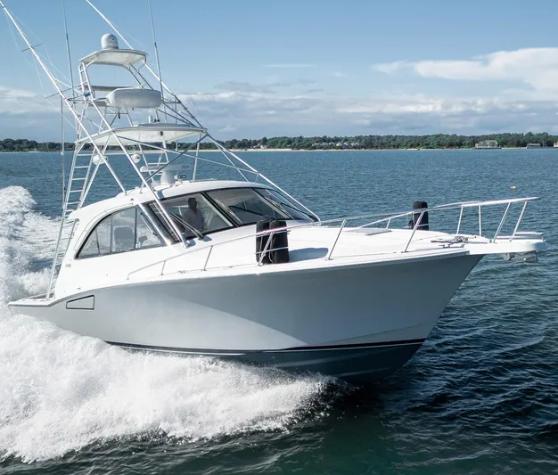 Wanted Yacht Photos Pics 2012 Cabo 44 HTX yacht cruising on open water.