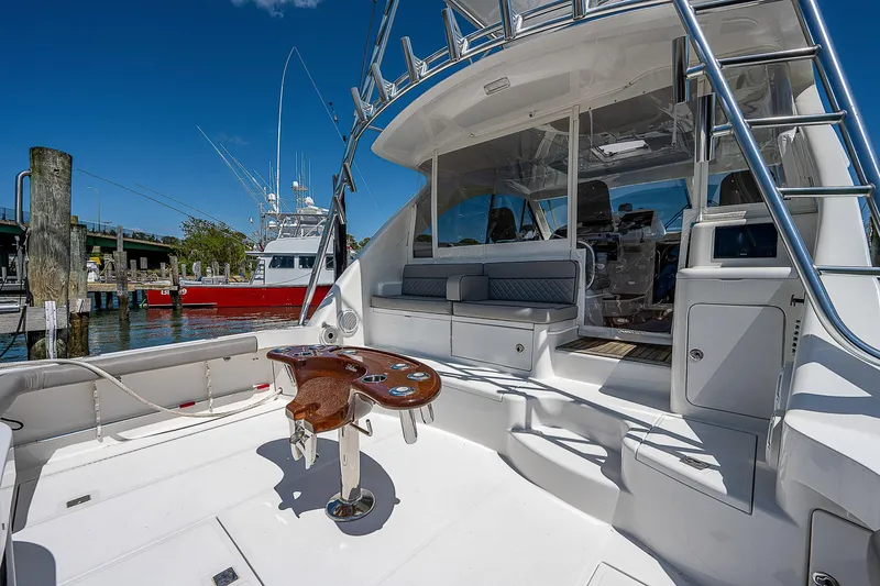 Wanted Yacht Photos Pics 2012 Cabo 44 HTX yacht deck with seating and fishing station.
