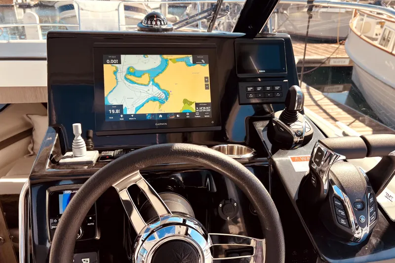 "halo" Yacht Photos Pics Helm of 2024 Jeanneau 8.95 boat with navigation display and controls.