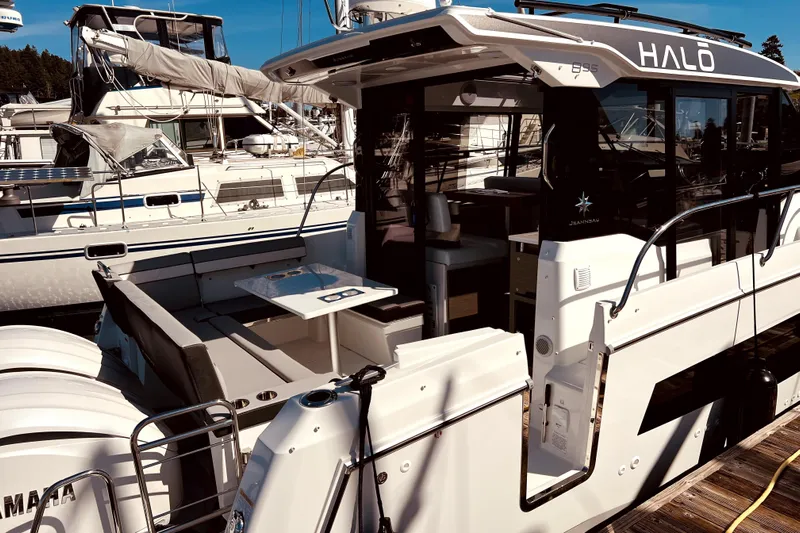 "halo" Yacht Photos Pics 2024 Jeanneau 8.95 boat docked, featuring spacious deck and modern design.