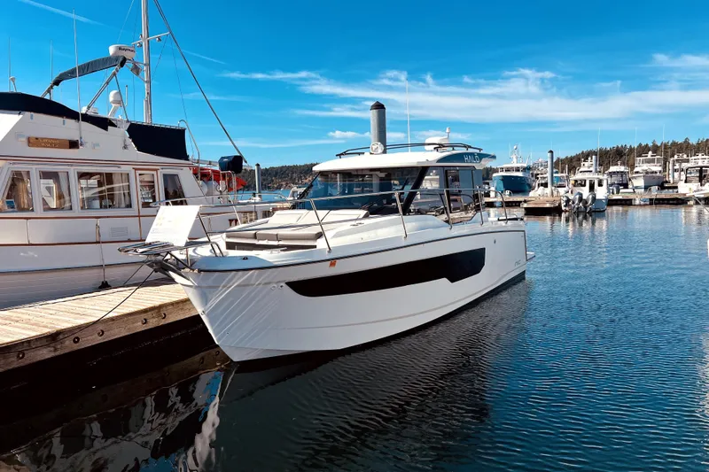 "halo" Yacht Photos Pics 2024 Jeanneau 8.95 boat docked in a marina under clear blue skies.