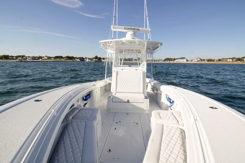  Yacht Photos Pics 2025 Yellowfin 32 Offshore boat on open water, featuring spacious deck and modern design.