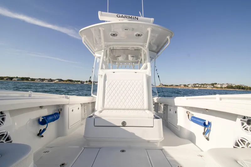  Yacht Photos Pics 2025 Yellowfin 32 Offshore boat interior with Garmin equipment on open water.