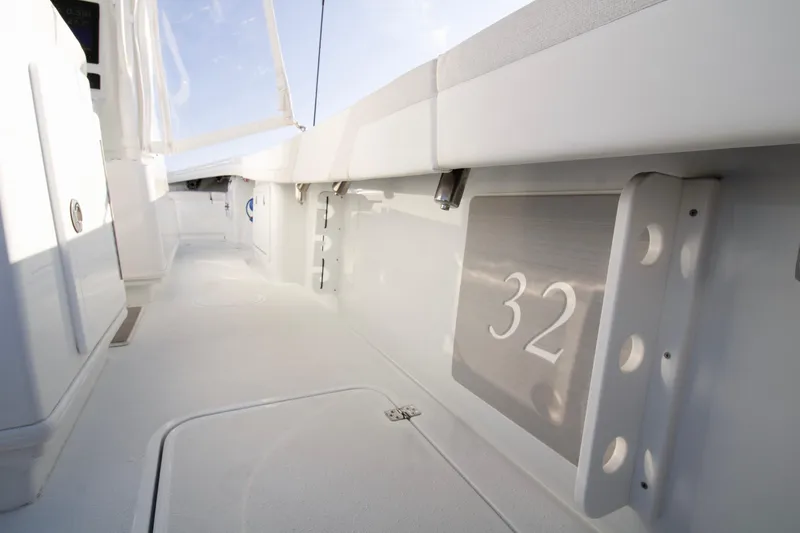  Yacht Photos Pics 2025 Yellowfin 32 Offshore boat interior, showcasing sleek white design and modern features.