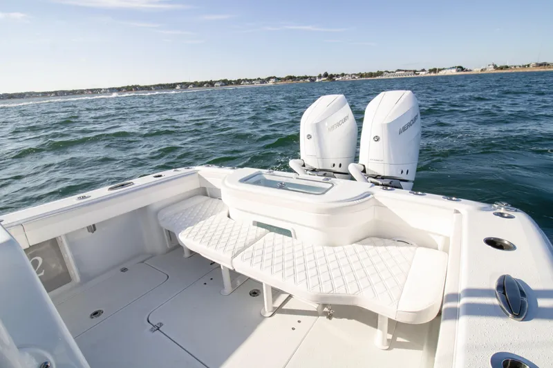  Yacht Photos Pics 2025 Yellowfin 32 Offshore boat with twin Mercury engines on open water.