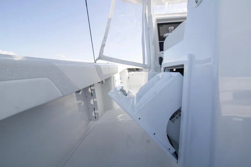  Yacht Photos Pics 2025 Yellowfin 32 Offshore boat interior with open storage compartment.