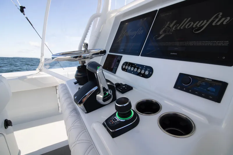  Yacht Photos Pics 2025 Yellowfin 32 Offshore boat cockpit with modern controls and navigation screens.