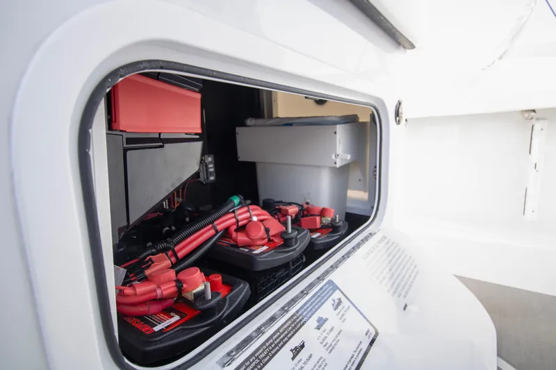 Yacht Photos Pics Battery compartment of 2025 Yellowfin 32 Offshore boat, showcasing electrical components.