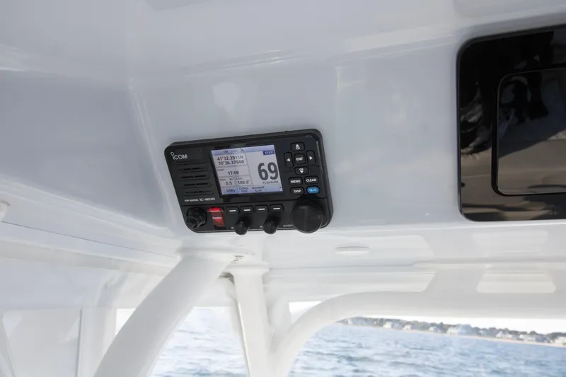  Yacht Photos Pics ICOM marine radio on 2025 Yellowfin 32 Offshore boat, displaying coordinates and channel.