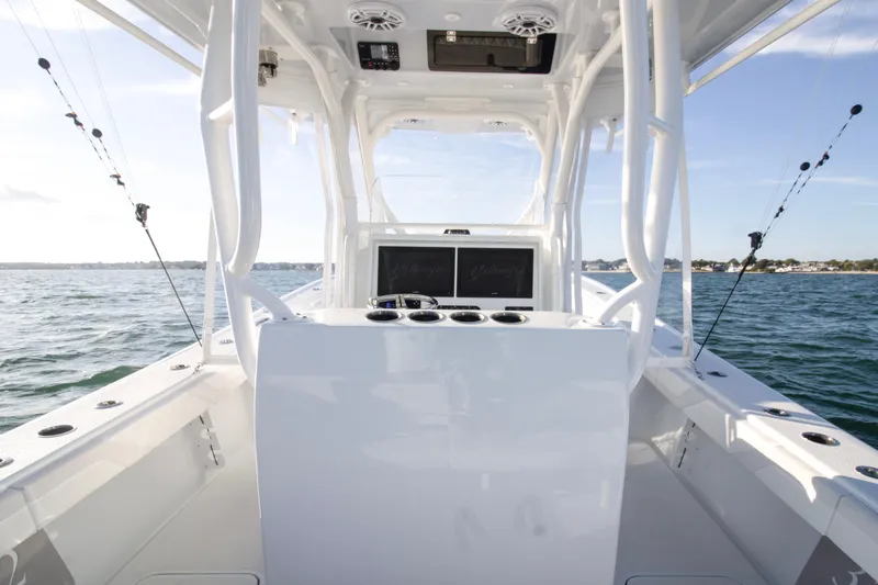  Yacht Photos Pics 2025 Yellowfin 32 Offshore boat interior with fishing rods, ocean view.