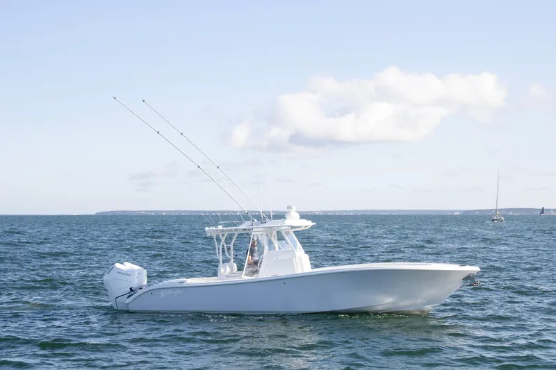  Yacht Photos Pics 2025 Yellowfin 32 Offshore boat cruising on open water under clear skies.