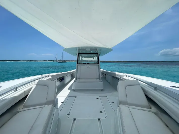  Yacht Photos Pics 2022 Yellowfin 39 Offshore boat on clear blue water, under a sunny sky.