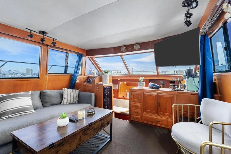 The Aquaholic Yacht Photos Pics Luxurious 1988 Marine Trader Trawler interior with modern decor and panoramic windows.