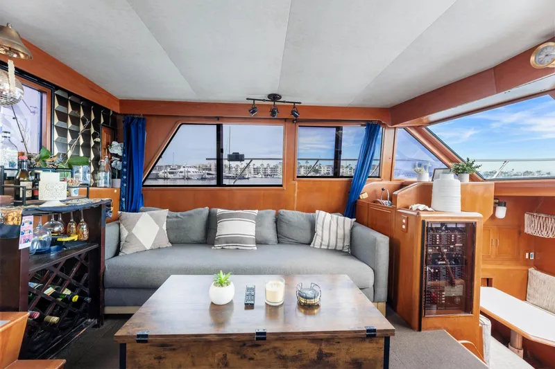 The Aquaholic Yacht Photos Pics Luxurious 1988 Marine Trader Trawler interior with cozy seating and elegant decor.