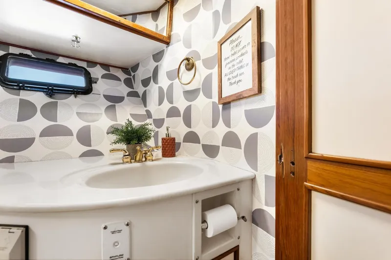 The Aquaholic Yacht Photos Pics Elegant 1988 Marine Trader Trawler bathroom with modern decor and stylish fixtures.
