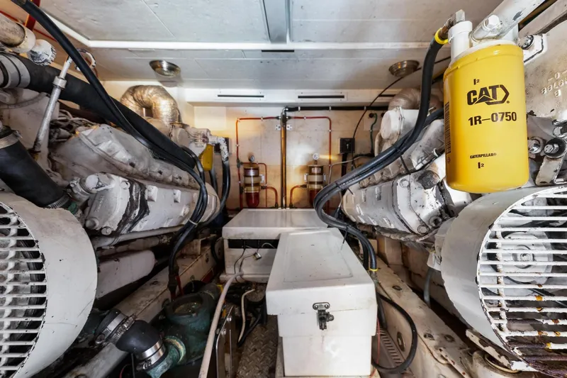 The Aquaholic Yacht Photos Pics Engine room of 1988 Marine Trader Trawler with Caterpillar components.