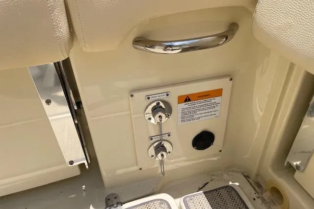  Yacht Photos Pics 2020 Chris-Craft Catalina 30 boat interior with control panel and safety warning.