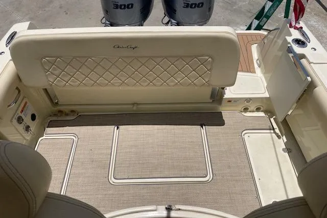  Yacht Photos Pics 2020 Chris-Craft Catalina 30 boat interior with cushioned seating and twin 300 engines.