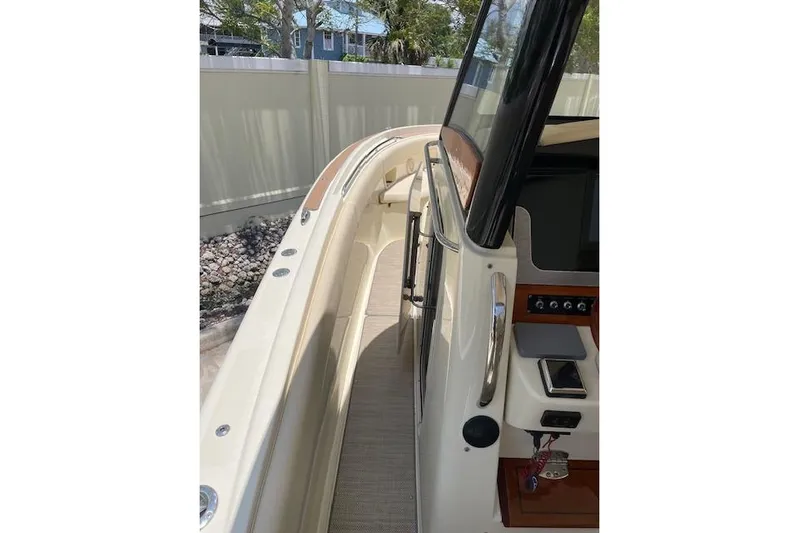  Yacht Photos Pics 2020 Chris-Craft Catalina 30 boat interior with sleek design and modern controls.