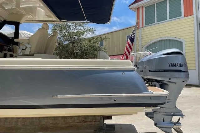  Yacht Photos Pics 2020 Chris-Craft Catalina 30 with Yamaha outboard motor, docked near colorful buildings.