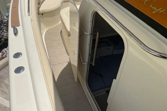  Yacht Photos Pics 2020 Chris-Craft Catalina 30 boat interior with open cabin door and seating area.