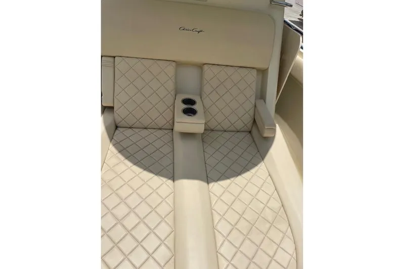  Yacht Photos Pics Luxurious seating on 2020 Chris-Craft Catalina 30 with diamond-pattern upholstery and cup holders.