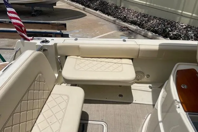  Yacht Photos Pics 2020 Chris-Craft Catalina 30 boat interior with beige seating and American flag.