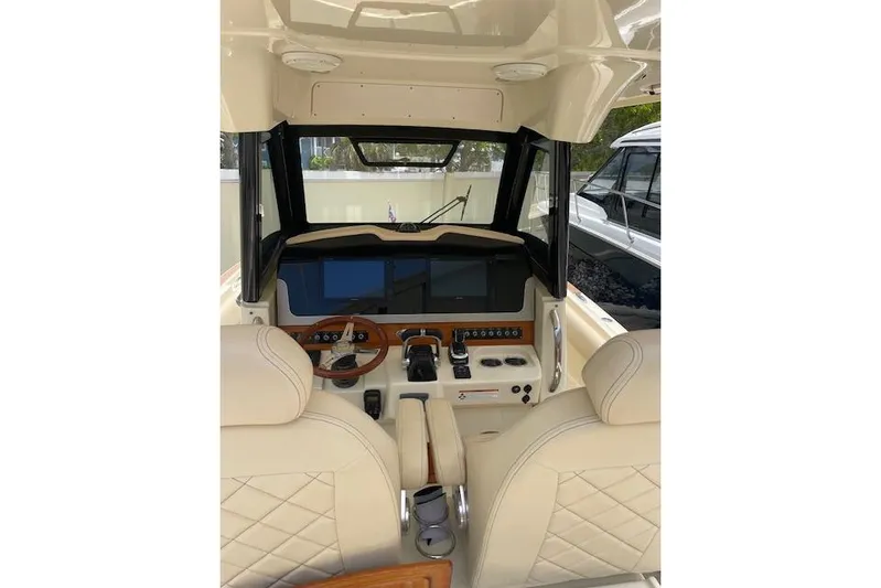  Yacht Photos Pics 2020 Chris-Craft Catalina 30 helm with dual screens and luxurious seating.