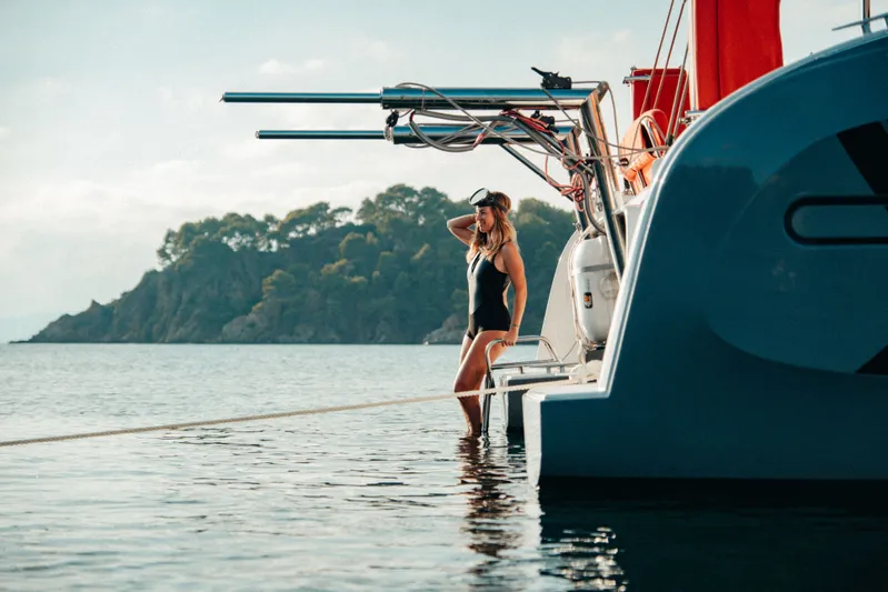 Tbd Yacht Photos Pics Woman on Excess 11 yacht in water, 2026 model.