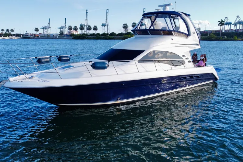  Yacht Photos Pics 2005 Sea Ray 420 Sedan Bridge yacht cruising on a sunny day.