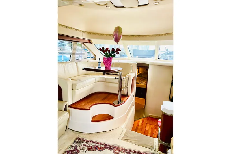  Yacht Photos Pics Luxurious interior of 2005 Sea Ray 420 Sedan Bridge with elegant seating and decor.