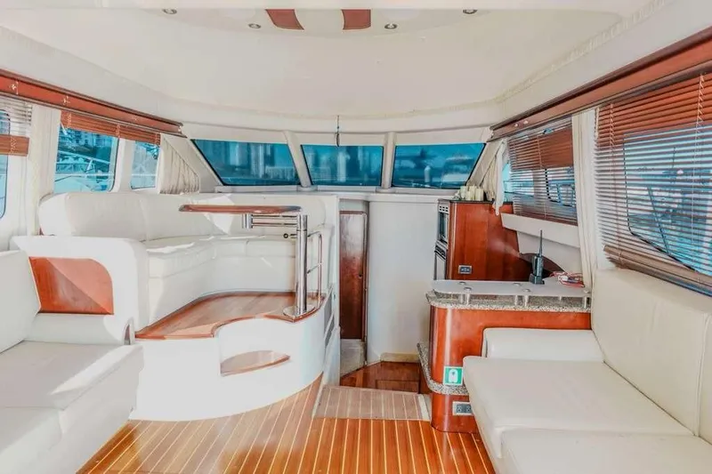  Yacht Photos Pics Luxurious interior of a 2005 Sea Ray 420 Sedan Bridge yacht with elegant seating and wood finishes.