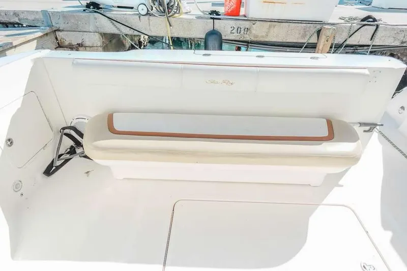  Yacht Photos Pics 2005 Sea Ray 420 Sedan Bridge boat seating area with white and tan cushions.