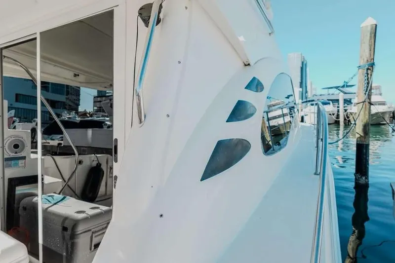  Yacht Photos Pics 2005 Sea Ray 420 Sedan Bridge yacht docked at marina, showcasing sleek design.