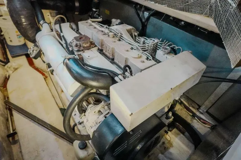  Yacht Photos Pics Engine room of a 2005 Sea Ray 420 Sedan Bridge yacht, showcasing mechanical components.