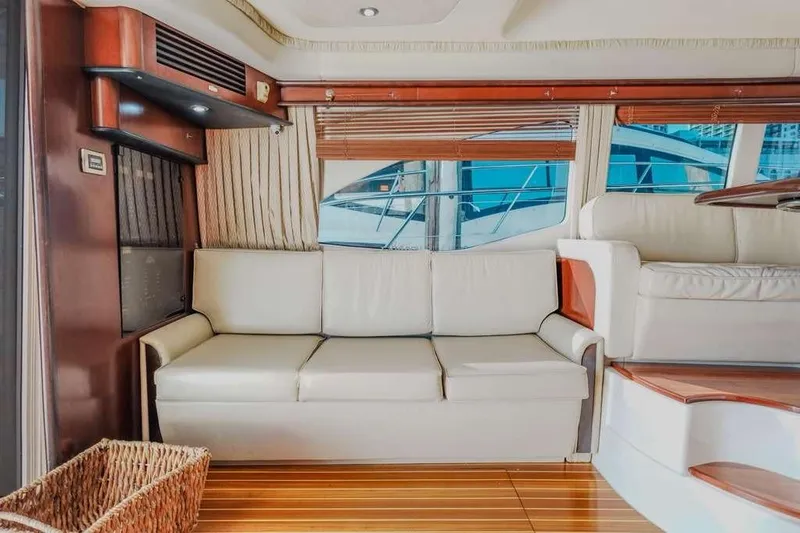  Yacht Photos Pics Luxurious interior of 2005 Sea Ray 420 Sedan Bridge yacht with white leather seating.