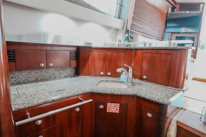  Yacht Photos Pics Luxurious kitchen area in 2005 Sea Ray 420 Sedan Bridge yacht with granite countertops.
