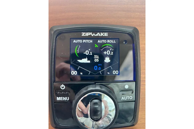 Fifth Child Yacht Photos Pics Zipwake control panel on a 2019 Back Cove 34O, displaying auto pitch and roll settings.