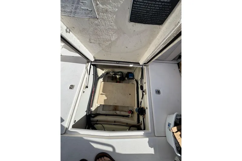  Yacht Photos Pics Open hatch of 2021 Ranger Tugs R-25 boat showing internal compartment details.