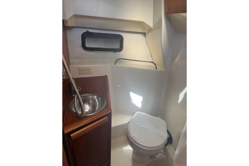  Yacht Photos Pics 2021 Ranger Tugs R-25 boat bathroom with sink, toilet, and window.