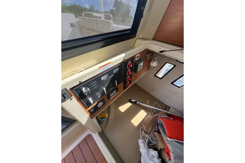  Yacht Photos Pics Interior view of 2021 Ranger Tugs R-25 boat control panel and cabin area.