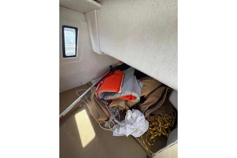  Yacht Photos Pics Interior storage of 2021 Ranger Tugs R-25 with life jacket and rope.