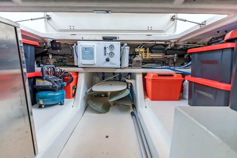 Mountain Mermaid Yacht Photos Pics Engine room of 2004 Offshore Yachts 54 Pilothouse with equipment and storage boxes.