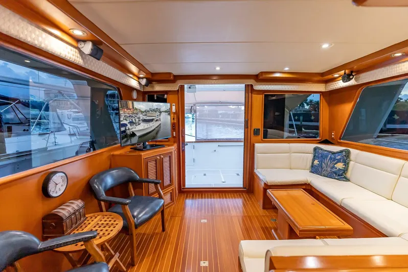 Mountain Mermaid Yacht Photos Pics Luxurious interior of 2004 Offshore Yachts 54 Pilothouse with elegant wood finish and comfortable seating.