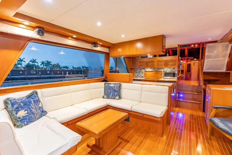 Mountain Mermaid Yacht Photos Pics Luxurious interior of 2004 Offshore Yachts 54 Pilothouse with elegant wood finish and spacious seating.